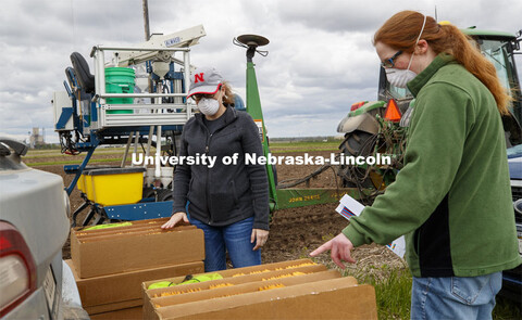 Research Manager Christine Smith explains the planting order to Brandi Sigmon, Assistant Professor o