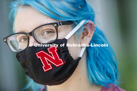 Atley Van Emmerik, a sophomore in dance from Glenvil, Nebraska wears a Husker mask. Photo shoot of s