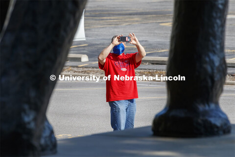 Evan Coleman, Computer, Technology and Web Support Associate with the CYFS group, takes a photo of A