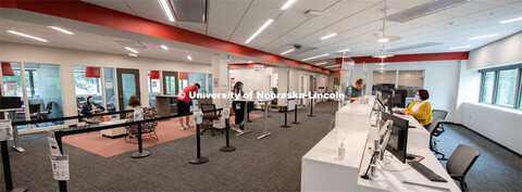 Ashley Cifuentes, peer specialist of Husker Hub, talks with student Zennith Boerger, in the new home