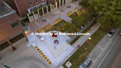 A group of young ladies take a selfie in front of Alumni Association's N Sculpture in the newly reno