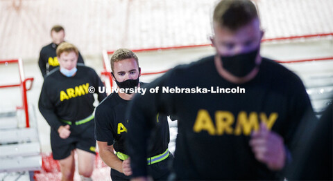 UNL ROTC cadets and Lincoln first responders run the steps of Memorial Stadium to honor those who di