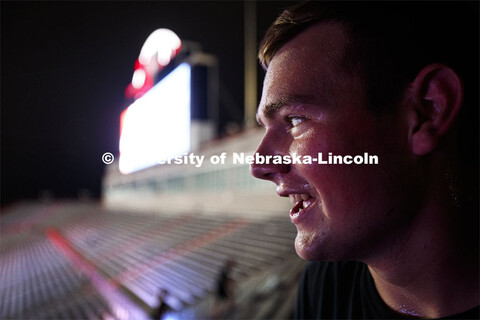 Air Force Cadet Ethan Roberts pauses at the top corner in northeast stadium before walking back to t