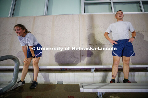 Air Force cadets Josie Svoboda and Ben Springer catch their breath at the top of the steps in north 