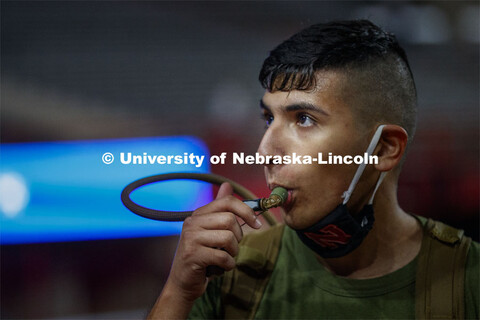 Roman Montes takes a drink from his Camelbak water pack. UNL ROTC cadets and Lincoln first responder