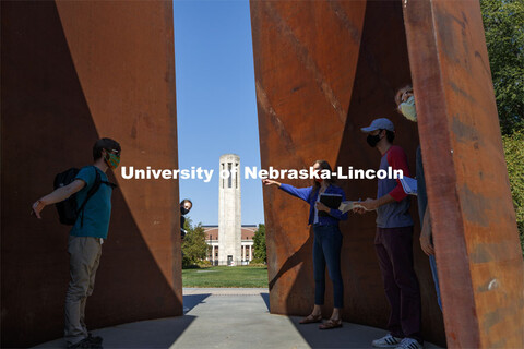 Professor, Anna Henson talks with her students as the Principles of Interactivity class takes an art