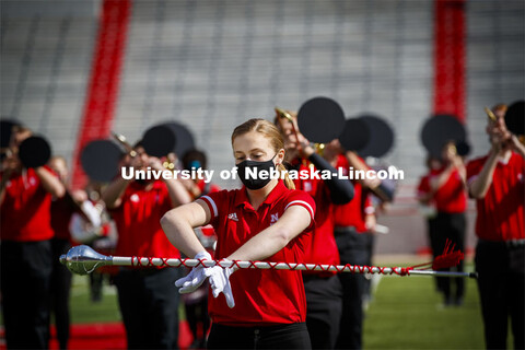 Cornhusker Marching Band, Cheer Squad and Homecoming Royalty met in the empty Memorial Stadium to re