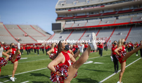 Cornhusker Marching Band, Cheer Squad and Homecoming Royalty met in the empty Memorial Stadium to re