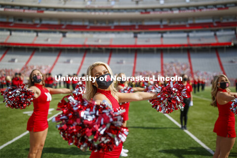 Cornhusker Marching Band, Cheer Squad and Homecoming Royalty met in the empty Memorial Stadium to re