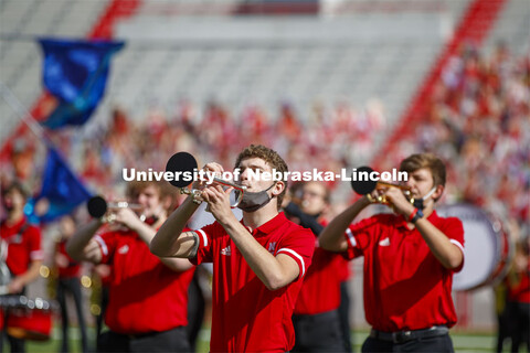 Cornhusker Marching Band, Cheer Squad and Homecoming Royalty met in the empty Memorial Stadium to re