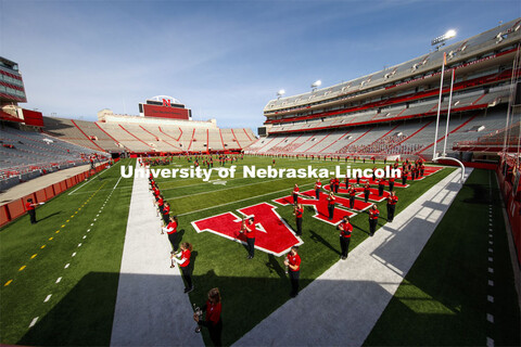 Cornhusker Marching Band, Cheer Squad and Homecoming Royalty met in the empty Memorial Stadium to re