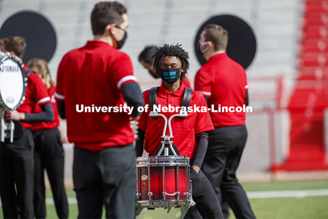 Cornhusker Marching Band, Cheer Squad and Homecoming Royalty met in the empty Memorial Stadium to re