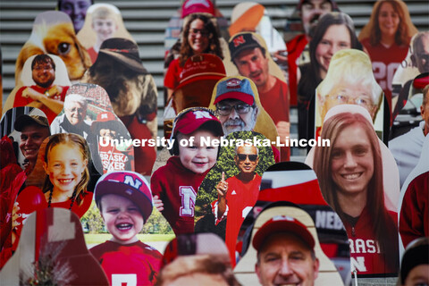 Cardboard cutouts of fans fill the stands in Memorial Stadium. Cornhusker Marching Band, Cheer Squad