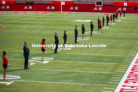 Cornhusker Marching Band, Cheer Squad and Homecoming Royalty met in the empty Memorial Stadium to re