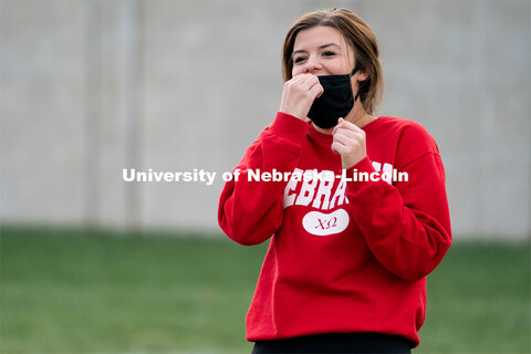 Chi Omega’s Sadie Lamplot laughs after a throw during the ASUN Cornhole Competition at the Cather-