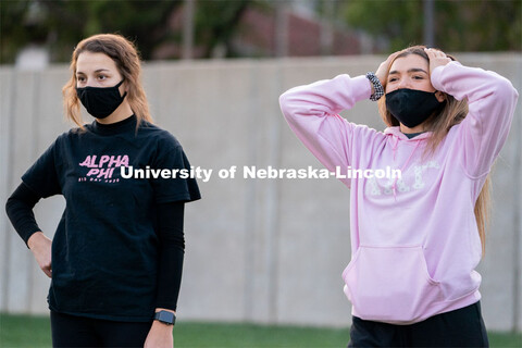 Kappa Kappa Gamma’s Liz Stacy (right) reacts to an errant throw during the ASUN Cornhole Competiti