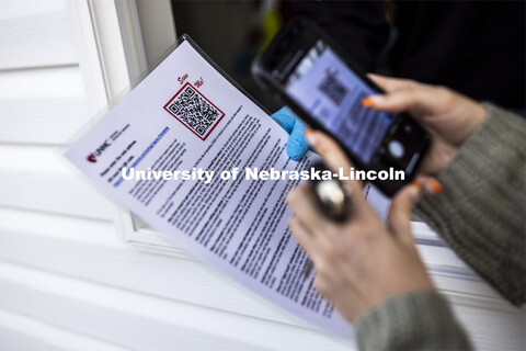 A QR code is scanned so the walk up person can sign in for testing. Participants in COVID testing at