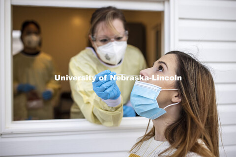 Erin Murray, Research Business Services Specialist for the Office of Research, is swabbed by Stephan