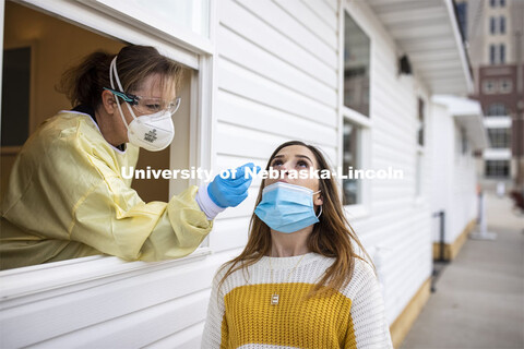 Erin Murray, Research Business Services Specialist for the Office of Research, is swabbed by Stephan