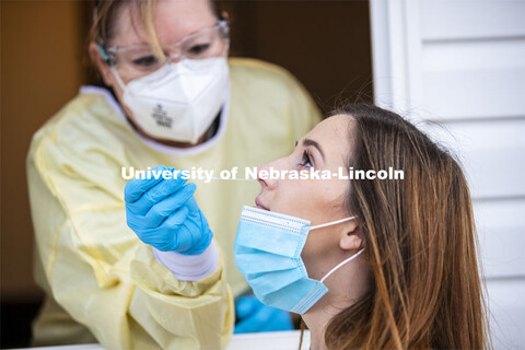 Erin Murray, Research Business Services Specialist for the Office of Research, is swabbed by Stephan