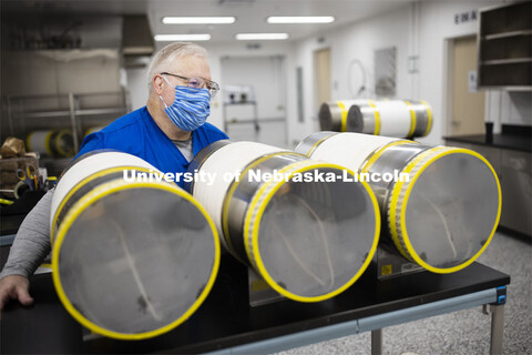 Robert Schmaltz, manager of the Gnotobiotic Mouse Facility, uses an autoclave to sterilize supply cy