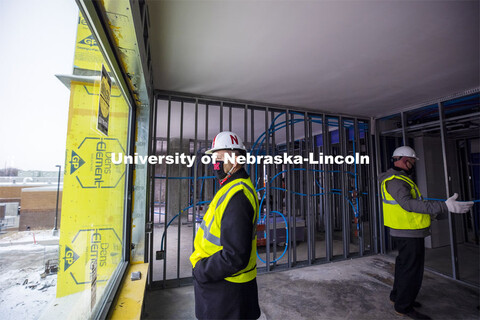 Chancellor Ronnie Green admires the view from a hotel room during a tour of the under-construction S