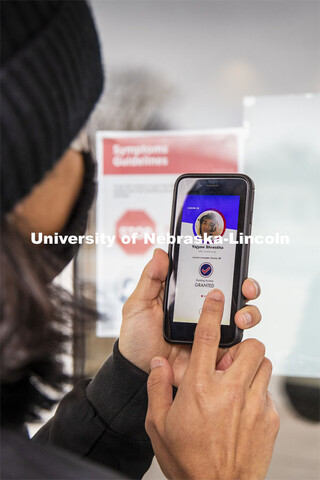 Yajyoo Shrestha shows the Safer Community app to be used as part of COVID testing on campus this spr