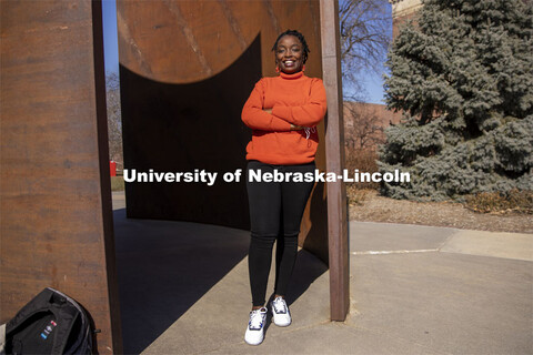 Shemsa Ndahiro Iribagiza, a senior integrated science major from Kigali, Rwanda, stands by the Green