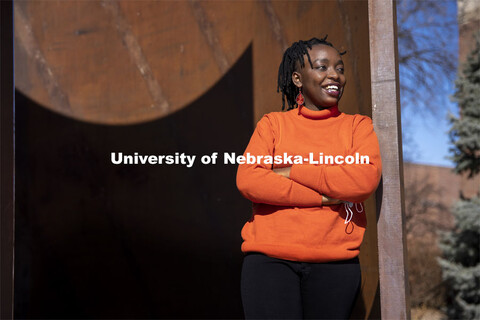 Shemsa Ndahiro Iribagiza, a senior integrated science major from Kigali, Rwanda, stands by the Green