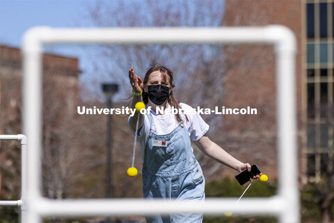 Jillian Baker plays ladder toss at Spring Breakout Festival. Students have fun at the Spring Breakou