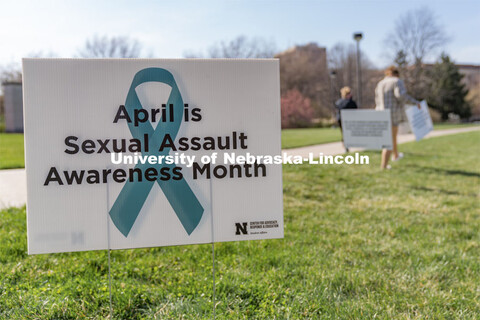 A sign recognizing April as sexual assault awareness month is placed on the Nebraska Union Greenspac