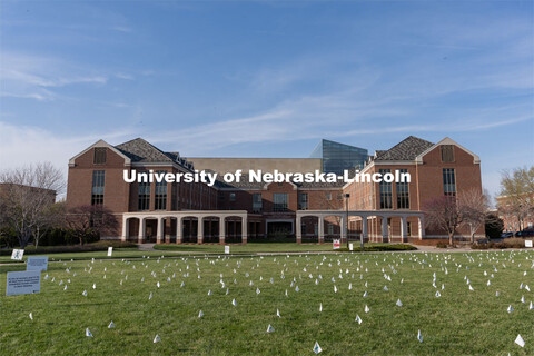 Flags are spread across the Nebraska Union Greenspace. Flags and signs are placed in the Nebraska Un