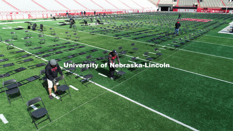 Chairs are set up on Tom Osbourne Field in Memorial Stadium for Saturday’s commencement. May 6, 20