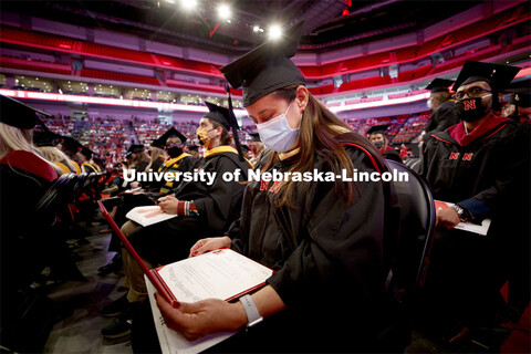 Rae-Linda Gomez-Pond, looks over her masters in natural resource sciences diploma. Graduate Commence