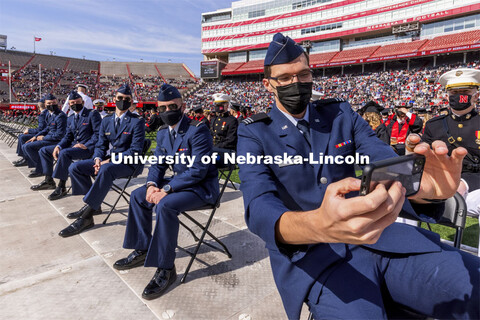 Air Force ROTC Cadet and engineering graduate Hunter Rausch takes a selfie of himself and fellow Air