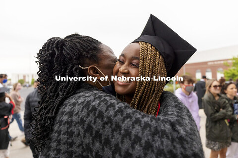 Amblessed Kanu-Asiegbu hugs family outside Memorial Stadium following the second ceremony. The unive