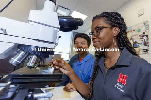 McNair scholar Alyssa Simpson adjusts a suspended ferroelectric oxide Pb(Zr,Ti)O3 membranes sample a