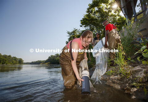 Meredith Sutton, graduate student in environmental engineering, pulls the sediment collection jar ou