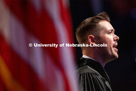 Trey Meyer, sings the national anthem at the Summer Graduate Commencement at Pinnacle Bank Arena. Au