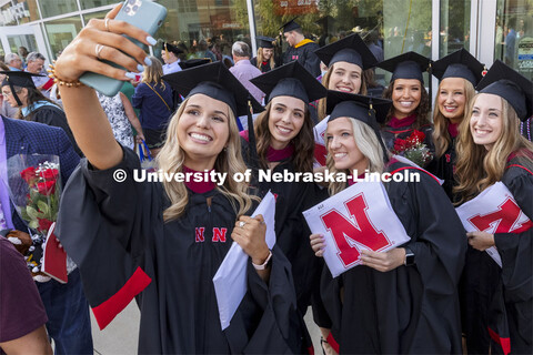 2021 speech-language pathology masters degree graduates gathered for a selfie outside Pinnacle Bank 