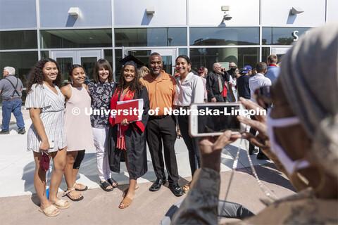 Noele Smith poses for her grandmother outside of Pinnacle Bank Arena. Undergraduate Commencement at 