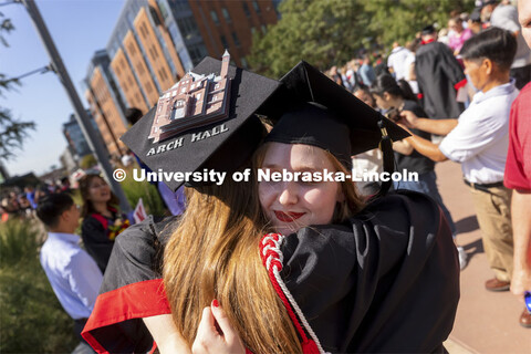 One last hug for 2020 architecture graduates Leia Farrens and Margaret Gies. Gies decorated her mort