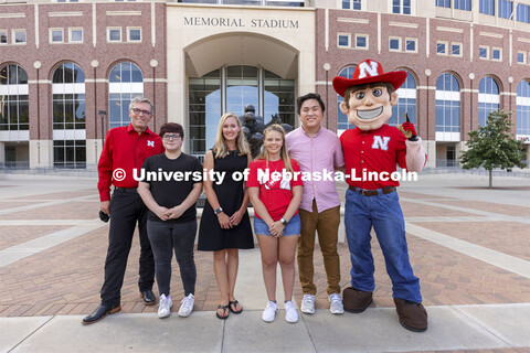 Chancellor Ronnie Green and Herbie stand outside Memorial Stadium on either side of the Voluntary CO