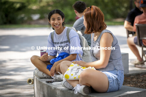 Mency Orellana and Rayni Wekluk talk outside the union. Students lined up at the Inaugural Soph S’