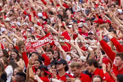 The student section hold up a Husker sign as they cheer on the team. Nebraska vs. Fordham University