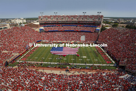 A US flag in the shape of the lower 48 states filled 50 yards of Tom Osborne Field for the national 