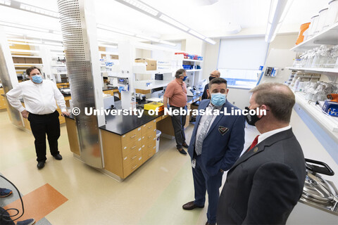 Joshua Santarpia, NSRI Research Director, answers a question from NU President Ted Carter during a t