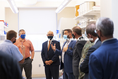 Joshua Santarpia, NSRI Research Director, answers questions during a tour of the facility. Ribbon cu