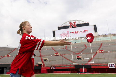 Abi Schoup, a senior on the mortar board team, tosses a bag during their competition Wednesday. Home