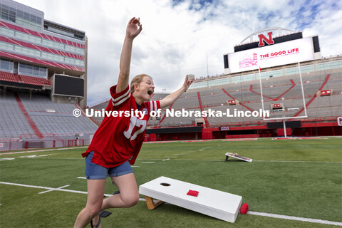 Abi Schoup, a senior on the mortar board team, reacts after scoring a cornhole. Homecoming Cornhole 